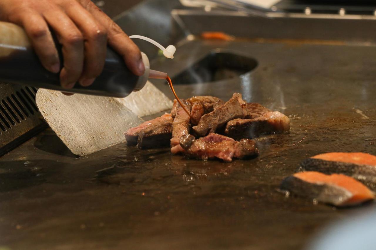 Chatrium Grand Bangkok Exterior photo Soy sauce being used in cooking