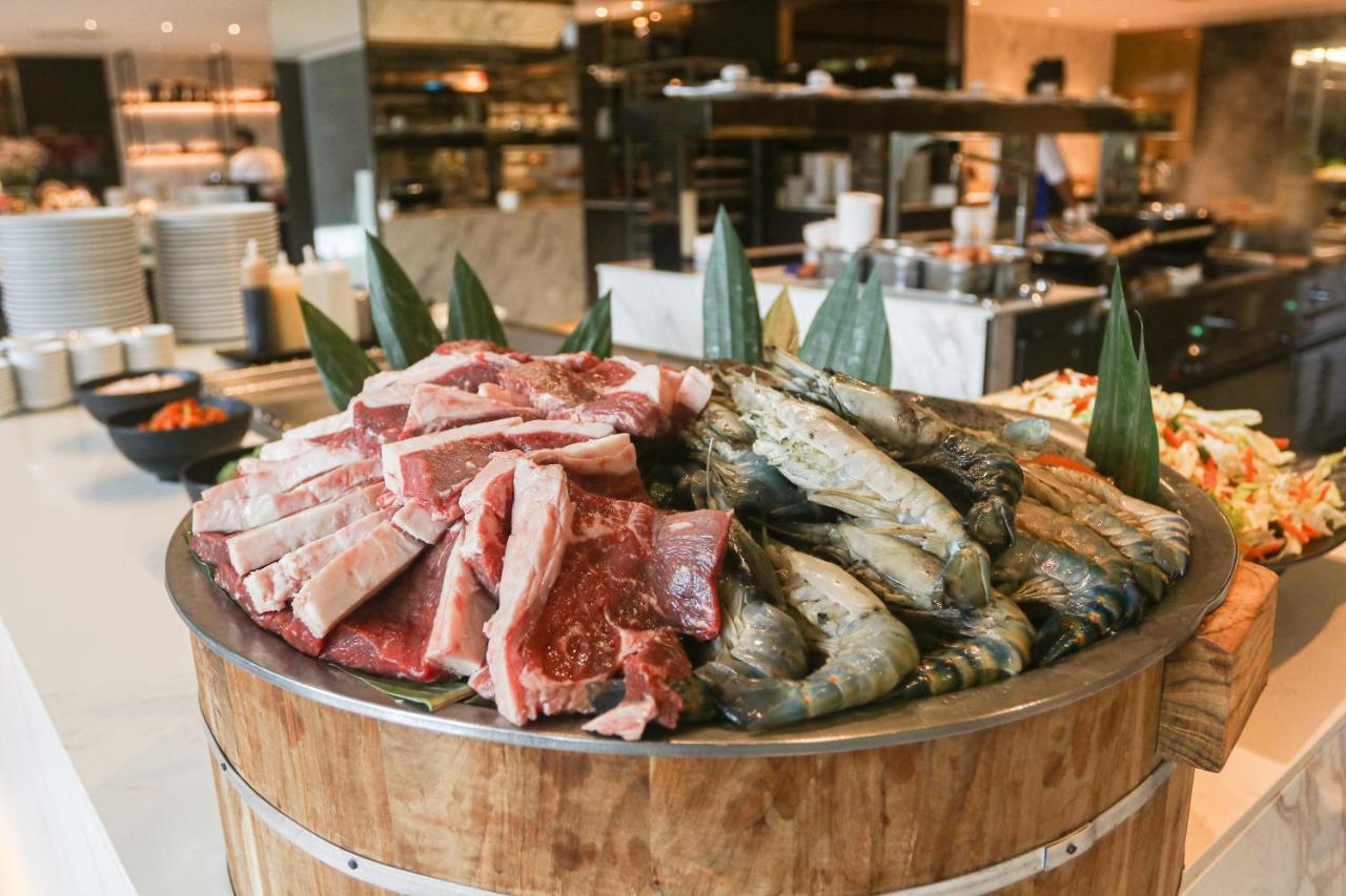 Chatrium Grand Bangkok Exterior photo A selection of fresh meat and seafood at a buffet