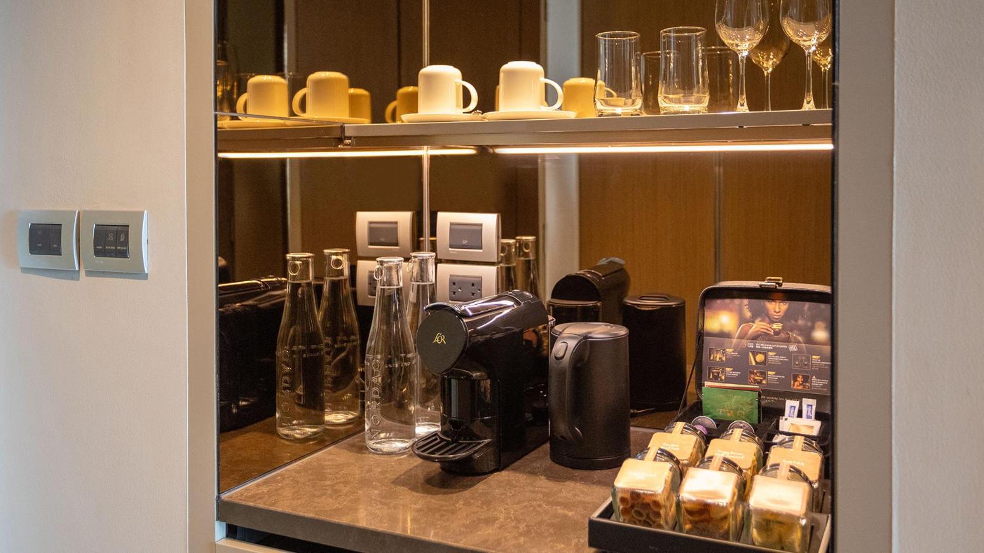 Chatrium Grand Bangkok Exterior photo A Nespresso machine in a hotel room