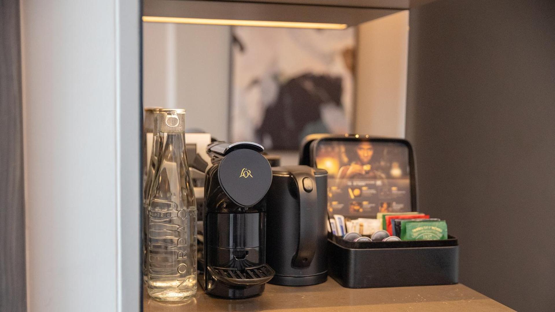 Chatrium Grand Bangkok Exterior photo A Nespresso coffee machine in a hotel room