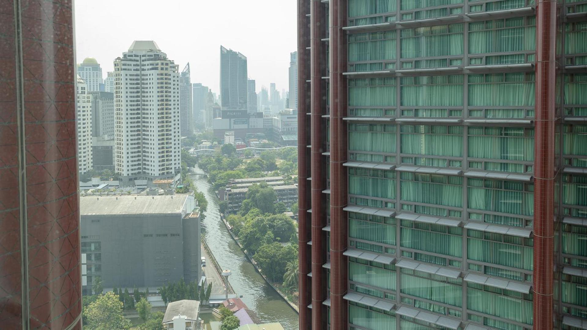 Chatrium Grand Bangkok Exterior photo View of the station from the nearby condominium